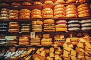 image of cheese wheels representing funny dutch sayings like eating cheese of something